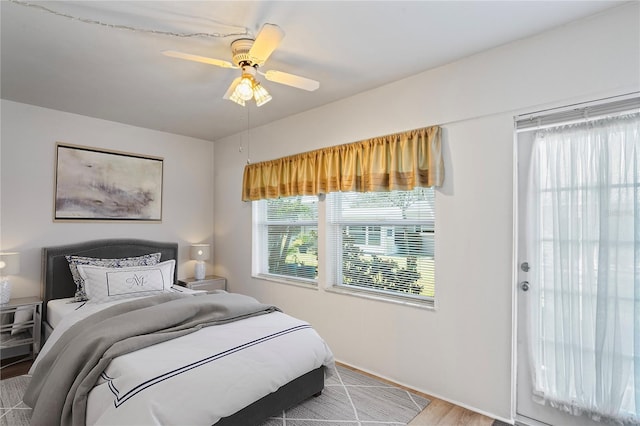 bedroom featuring ceiling fan and light hardwood / wood-style floors