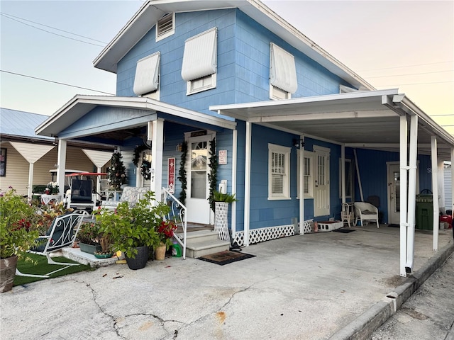 view of front of property with a carport