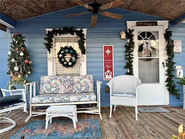 wooden terrace featuring ceiling fan