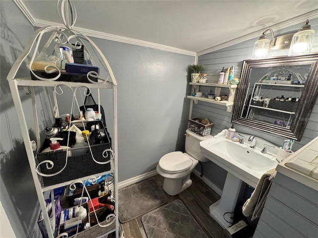 bathroom with hardwood / wood-style floors, toilet, ornamental molding, and sink