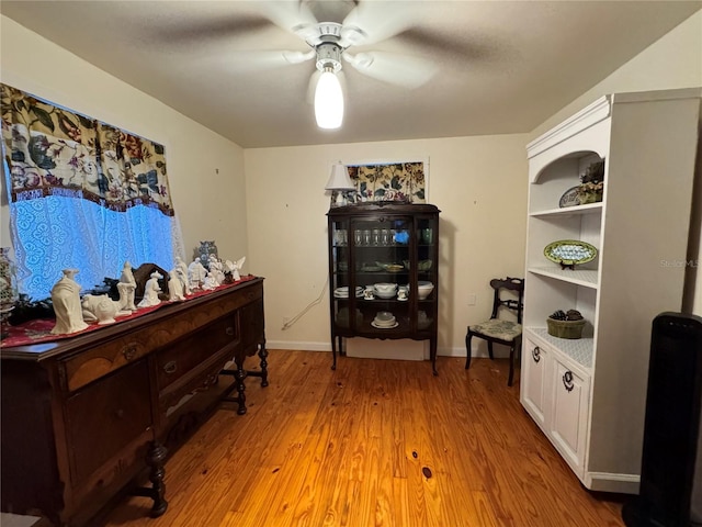 office area with ceiling fan and light hardwood / wood-style flooring