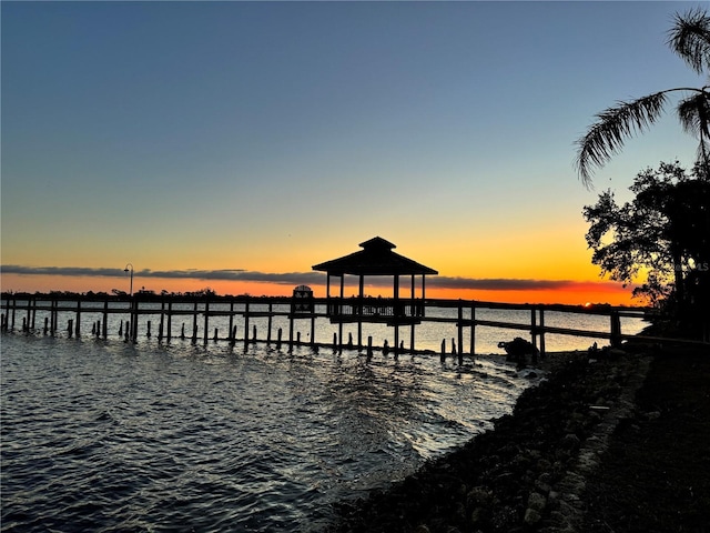 dock area featuring a gazebo and a water view