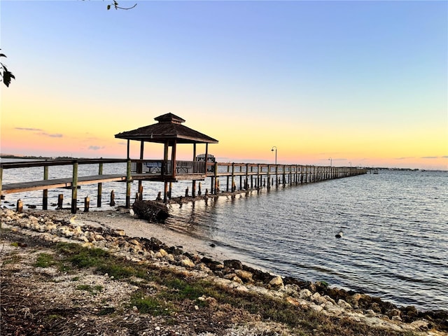 dock area featuring a gazebo and a water view