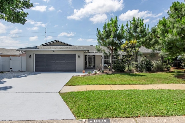 view of front of house with a front lawn and a garage