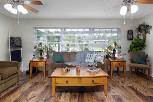 living room featuring hardwood / wood-style floors and ceiling fan