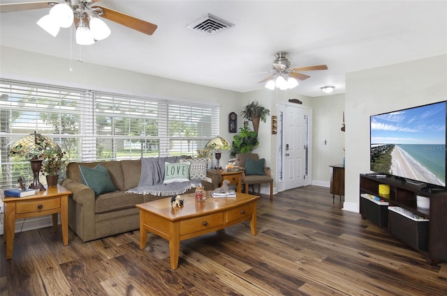 living room featuring ceiling fan, plenty of natural light, and dark hardwood / wood-style floors