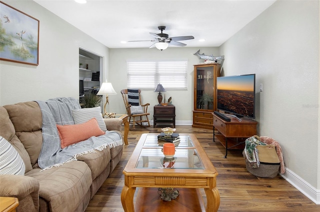 living room with hardwood / wood-style floors and ceiling fan