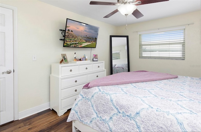 bedroom featuring ceiling fan and dark wood-type flooring