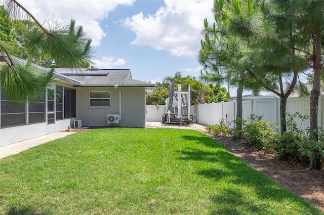 view of yard featuring a sunroom