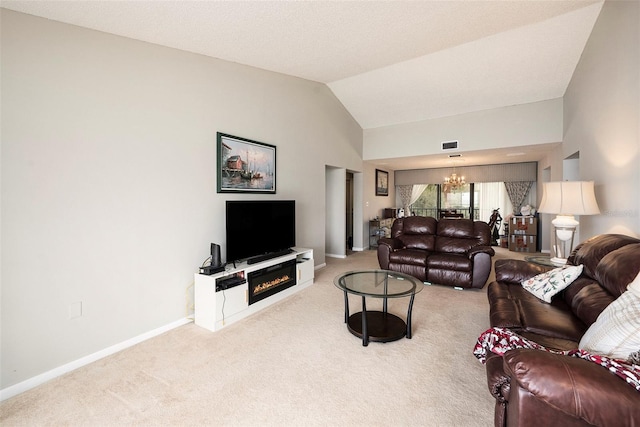 carpeted living room with vaulted ceiling and a chandelier