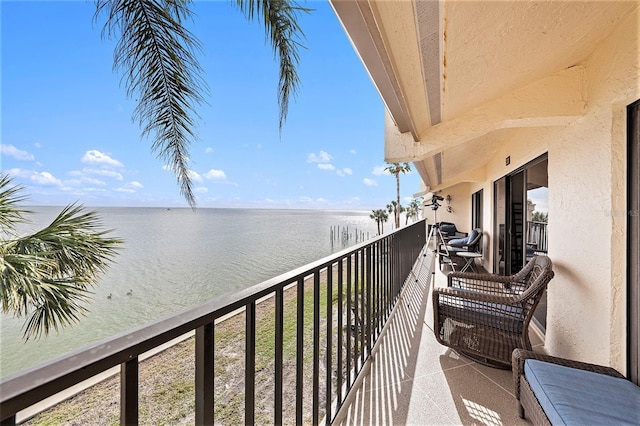 balcony featuring a water view