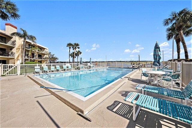 view of swimming pool with a patio