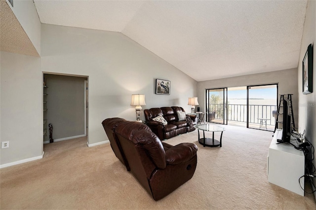living room featuring light carpet, lofted ceiling, baseboards, and a textured ceiling