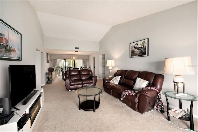 carpeted living room featuring vaulted ceiling and a chandelier