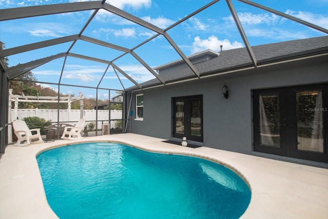 view of pool featuring a lanai, a patio, and french doors