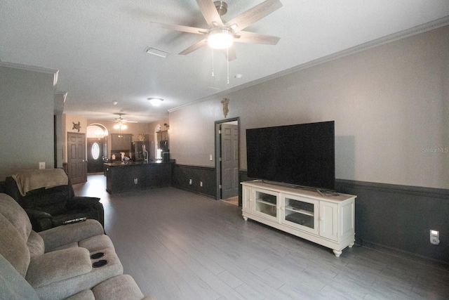 living room featuring hardwood / wood-style flooring and ornamental molding