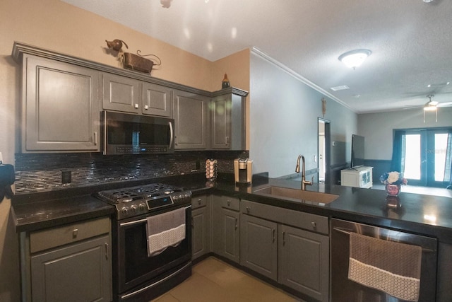 kitchen featuring light tile patterned floors, stainless steel appliances, tasteful backsplash, and sink