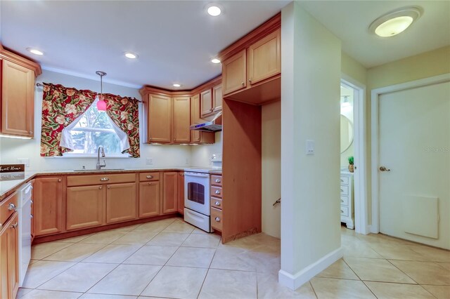 kitchen featuring white appliances, light tile patterned floors, a sink, light countertops, and under cabinet range hood