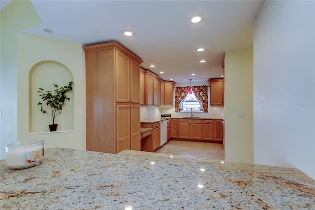 kitchen with light tile patterned floors, light stone countertops, recessed lighting, a sink, and dishwasher