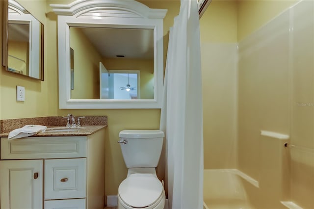 full bath featuring toilet, vanity, and a shower with curtain