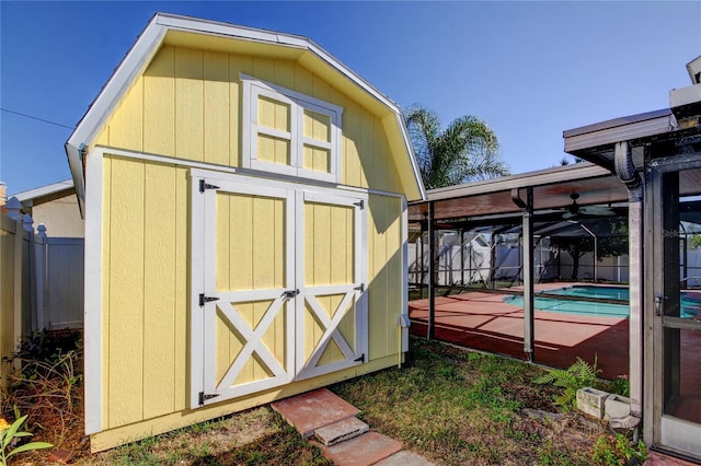 view of shed featuring a fenced in pool and fence