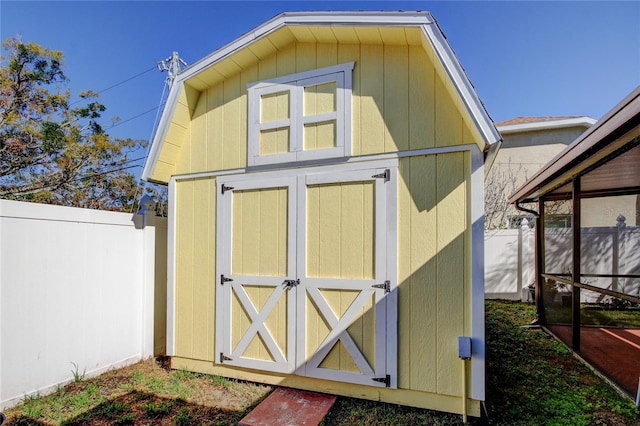 view of shed with a fenced backyard