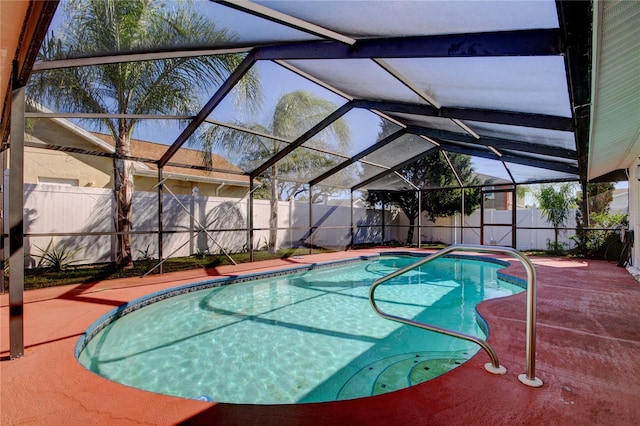 view of swimming pool with a lanai, a fenced in pool, a patio, and a fenced backyard