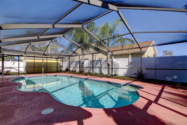 view of pool with a lanai, a fenced in pool, a patio, and a fenced backyard