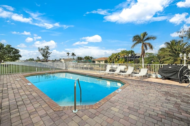 view of swimming pool featuring a patio