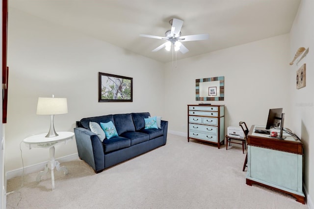 carpeted living room with ceiling fan