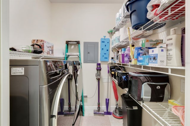 clothes washing area with independent washer and dryer and electric panel