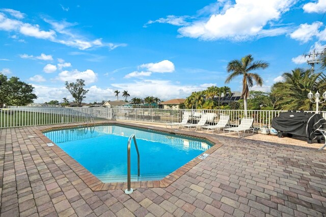 403 SW 47th Ter Unit 203, Cape Coral, FL 33914 - community pool featuring a patio area