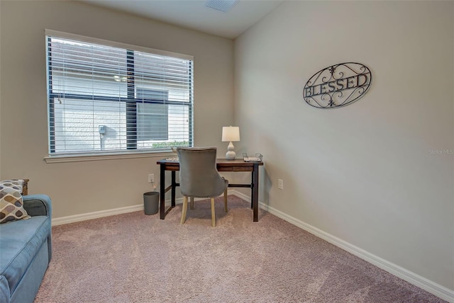 carpeted home office with a wealth of natural light