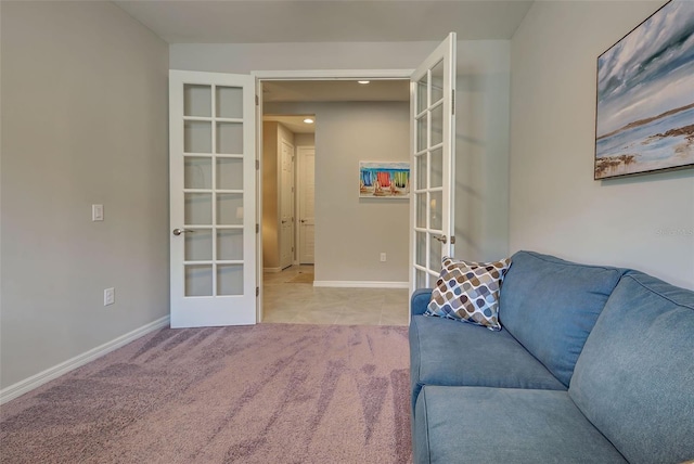 living area with light carpet and french doors