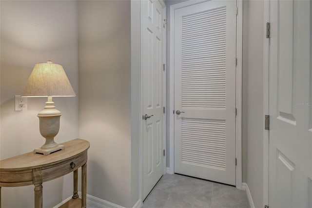 entryway with light tile patterned flooring