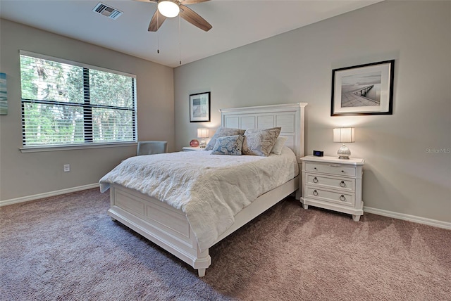 bedroom with dark carpet and ceiling fan