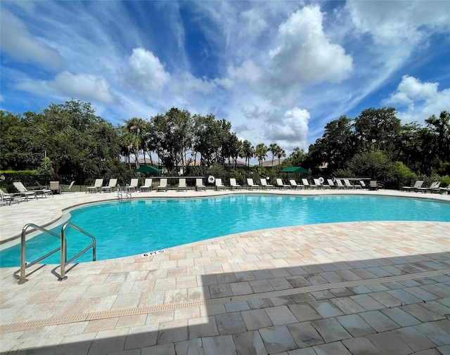 view of swimming pool featuring a patio