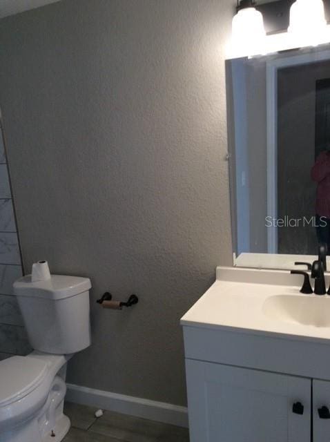 bathroom with vanity and toilet