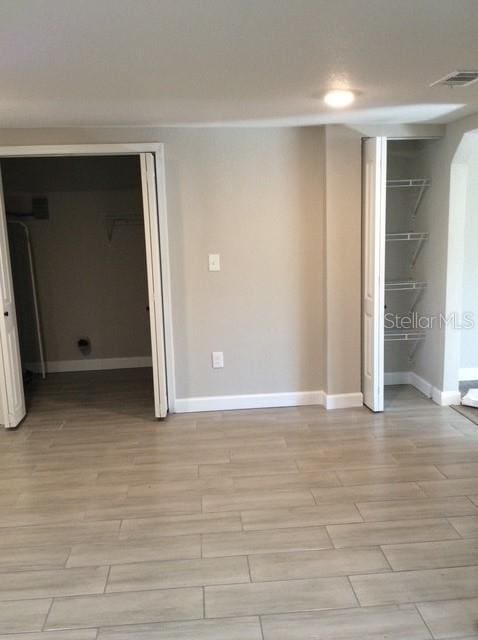 spare room featuring light hardwood / wood-style flooring