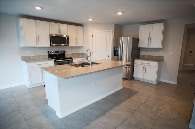 kitchen with sink, white cabinetry, and stainless steel appliances