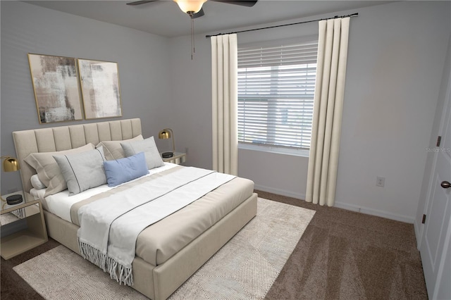 bedroom featuring ceiling fan and carpet