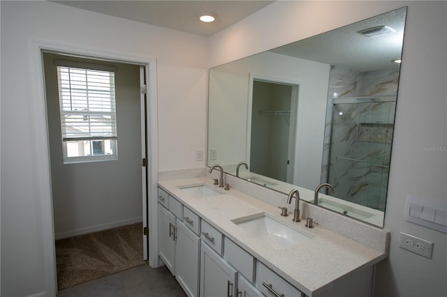 bathroom with vanity, tile patterned floors, and a shower with door