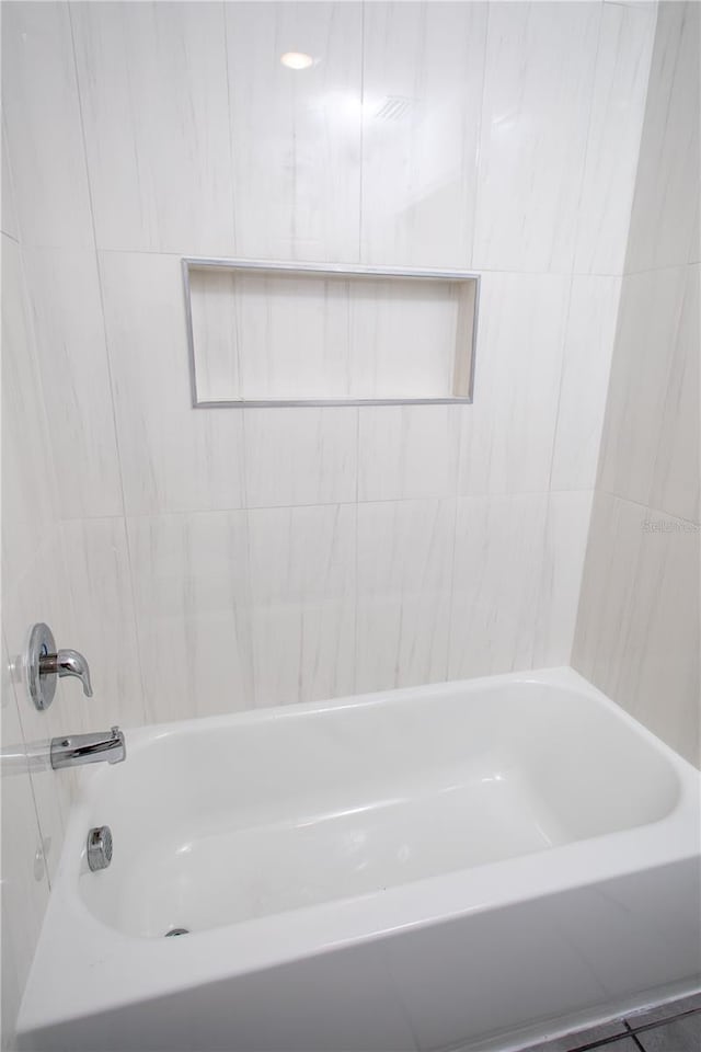 bathroom with tile patterned floors