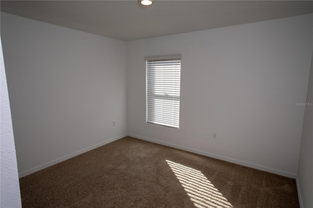 spare room featuring carpet flooring