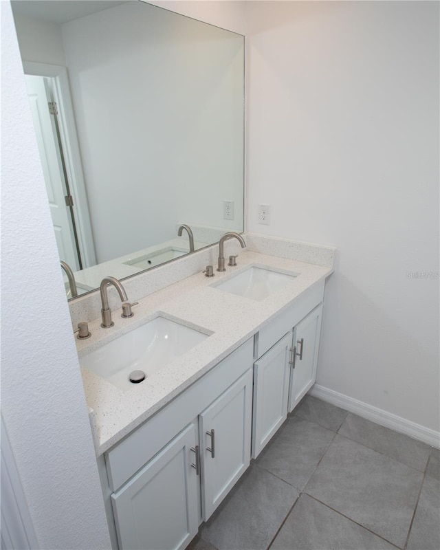 bathroom with tile patterned floors and vanity