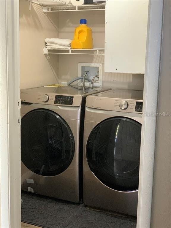 laundry room featuring washing machine and dryer