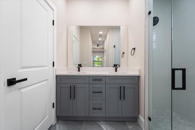 bathroom featuring walk in shower, vanity, and ceiling fan