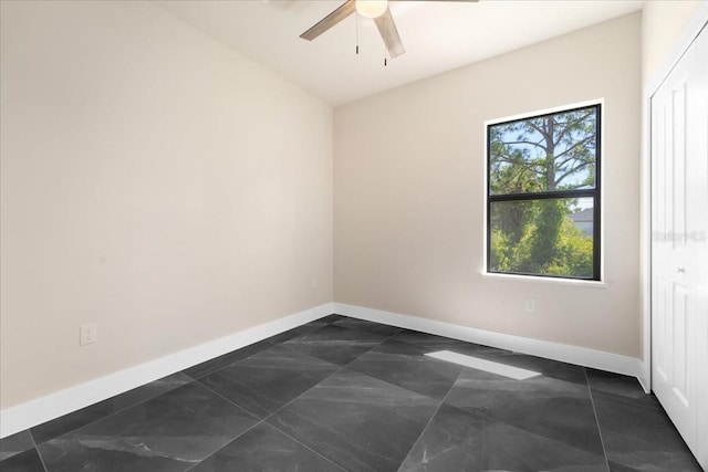 spare room with ceiling fan