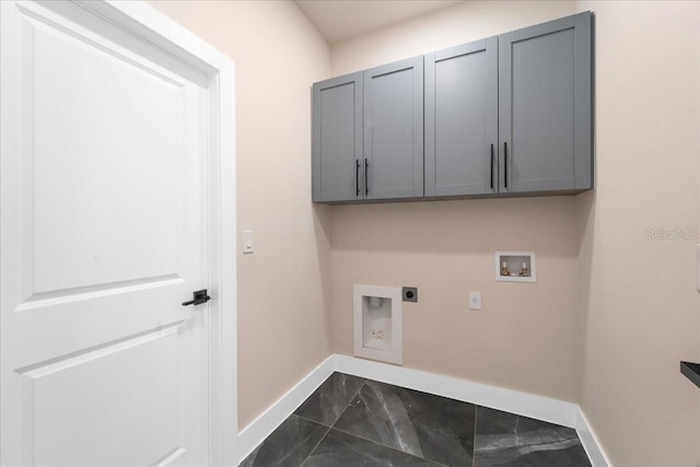 laundry area with hookup for an electric dryer, cabinets, and washer hookup