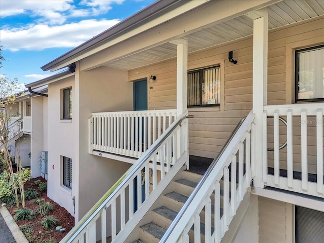 entrance to property featuring a porch